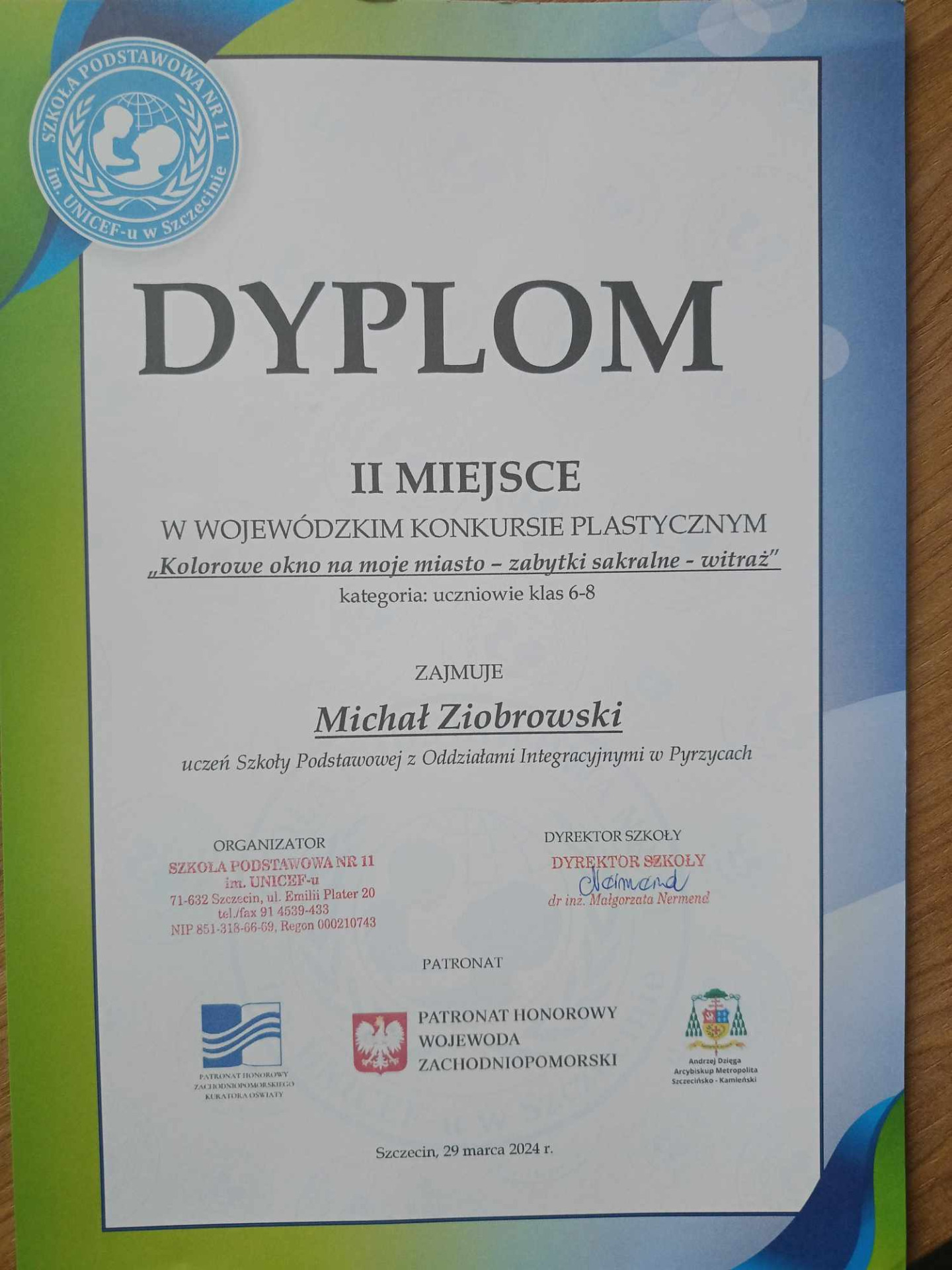 Dyplom dla Michała Ziobrowskiego za zajęcie II miejsca w Wojewódzkim Konkursie Plastycznym "Kolorowe okna na moje miasto- witraż".